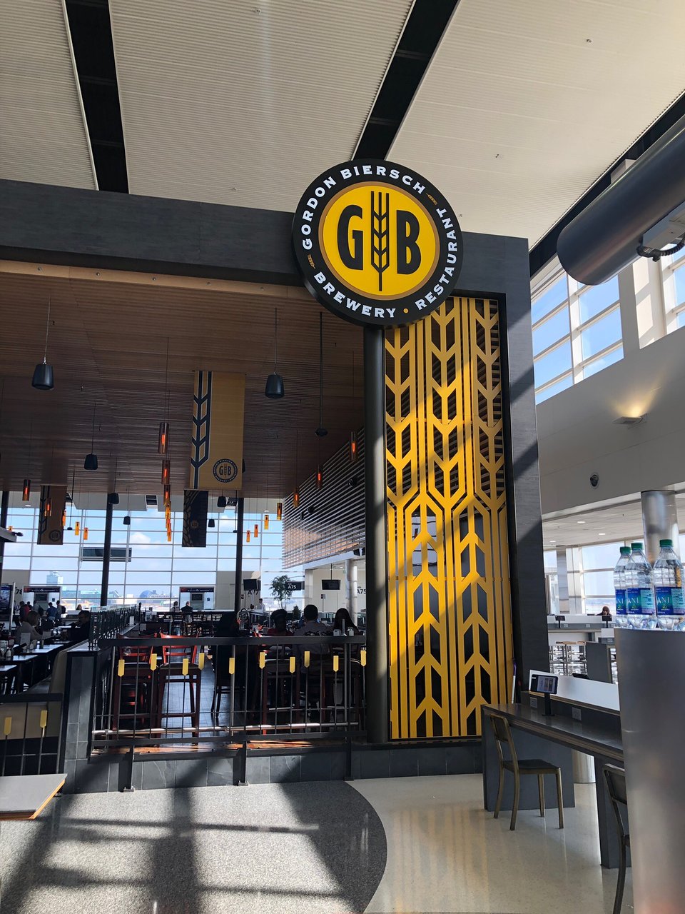 External view of T.G.I. Friday's restaurant entrance within an airport terminal.